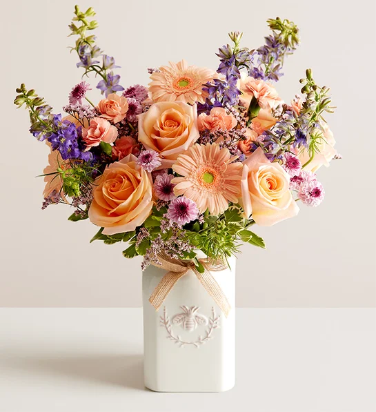 A vase with anniversary flowers in it